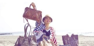 I HeART New Jersey – The Best Textile Artists: Part Two Photo of woman showing off handbags on the beach made by Crystal Kodada