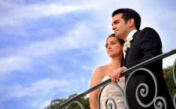 Jessica Lauren Photography Jessica Lauren Photography Bride and Groom on balcony